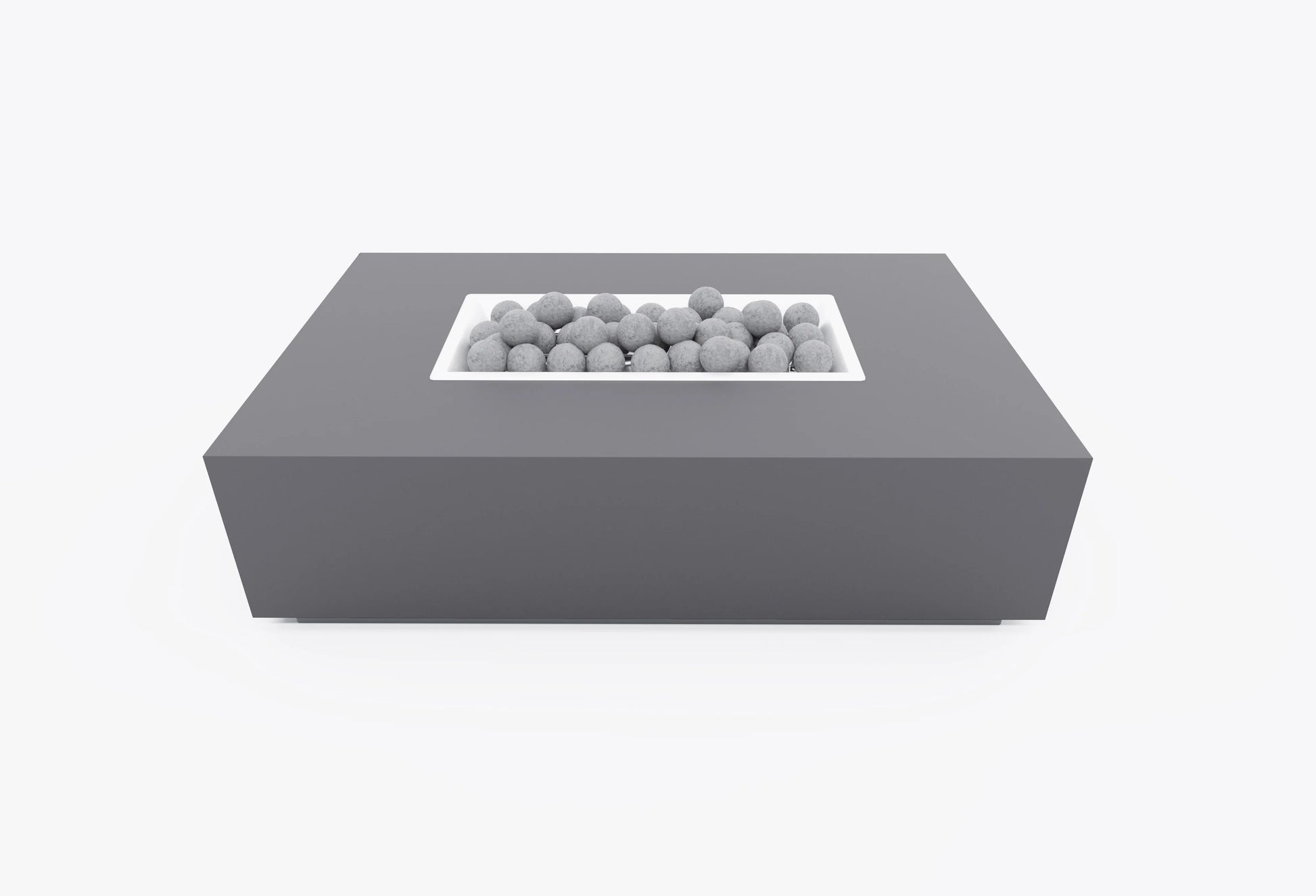 Rectangular concrete outdoor fire pit table with recessed burner and fire stones