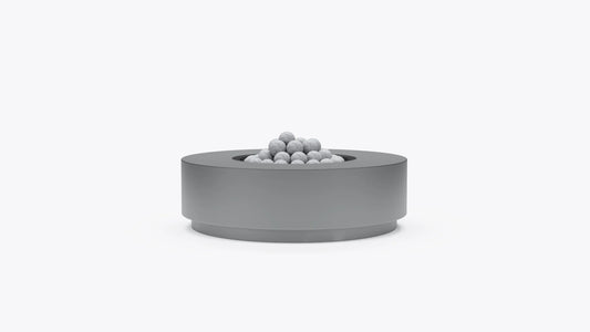 Round concrete outdoor fire pit table with recessed burner and fire stones